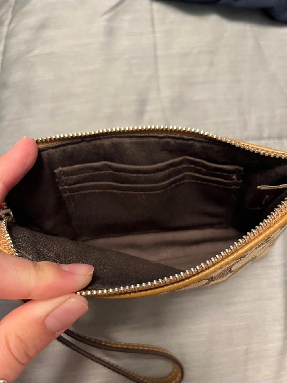 COACH Signature Canvas Floral Wristlet in Brown